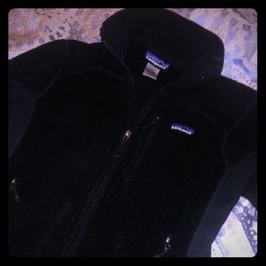 Small, black Patagonia zip up.