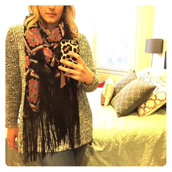Black, pink, and gray patterned scarf with fringe