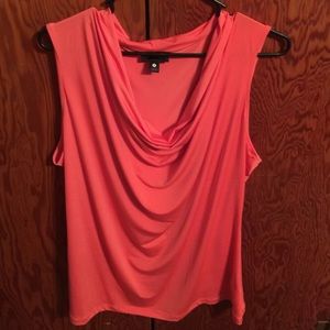 Salmon colored sleeveless top.