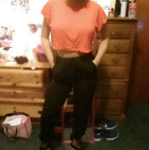 red crop top with black joggers