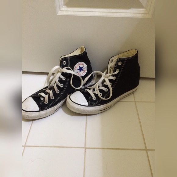 Black and white all star high top converse