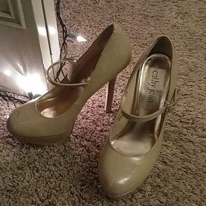 Cathy Jean beige strap over heels