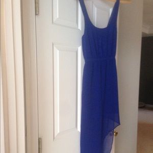 Backless dress cut with an asymmetrical hem.