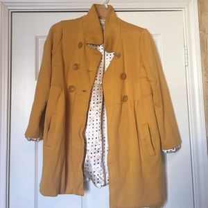 Super cute mustard colored coat.