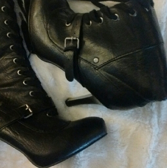 Black high heeled lace up boots
