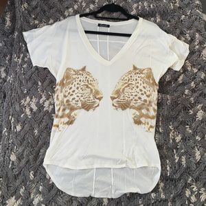 Cream colored top with leopards