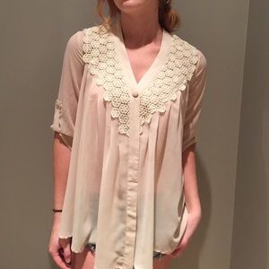 Sheer, cream blouse