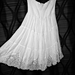 Gorgeous white dress with sweet detail.