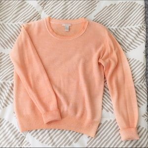 Bright orange sweater