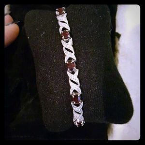 Sterling silver and garnet tennis bracelet