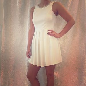 White dress with bow detail on the back