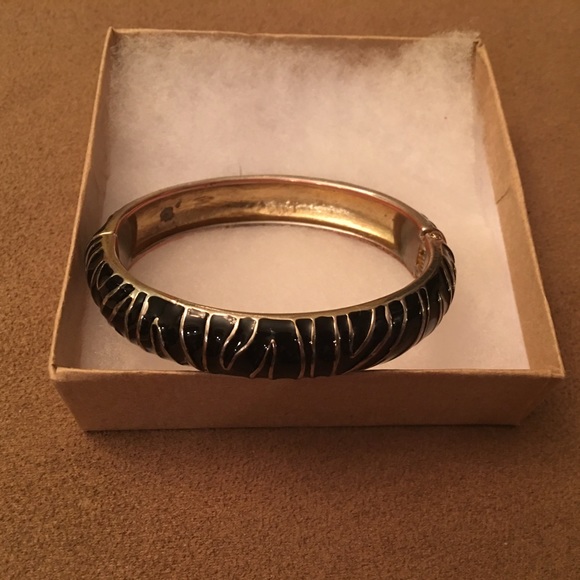 Black and gold bangle bracelet.