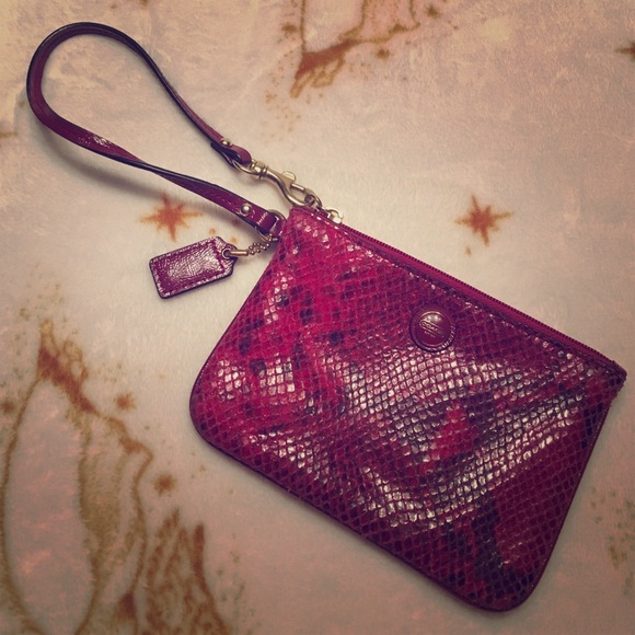 Pink snake skin looking Coach wristlet