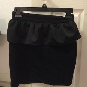 Black peplum skirt with zipper on back
