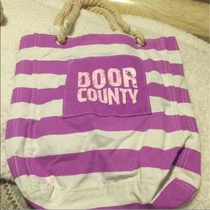 Purple and white striped door county bag