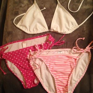 White bathing suit top with two bottoms