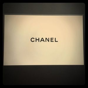 Chanel box with red Chanel ribbon