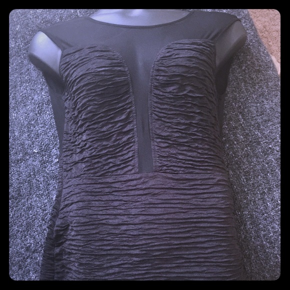 Black ruffled mini dress with a see thru back!