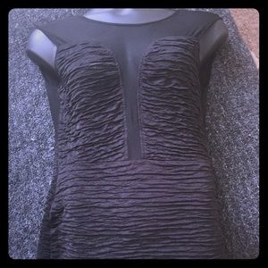 Black ruffled mini dress with a see thru back!