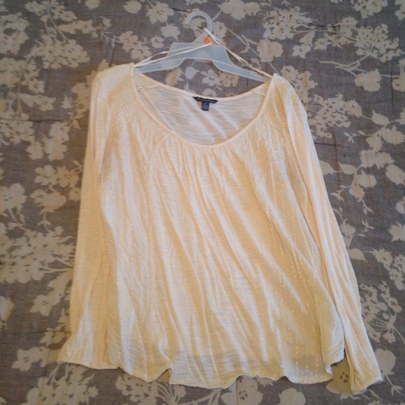 Rayon top. Has small hole on back right shoulder.