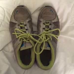 Green and silver used sneakers