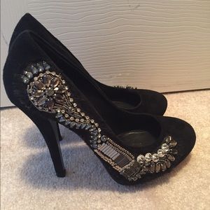 Black suede heel with rhinestone embellishments