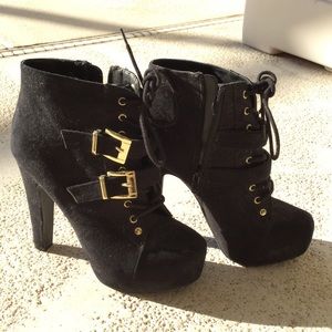 Black and gold high heel boots