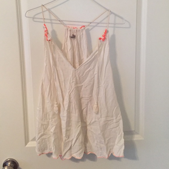 White tank top with neon coral stitching