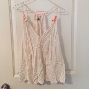 White tank top with neon coral stitching