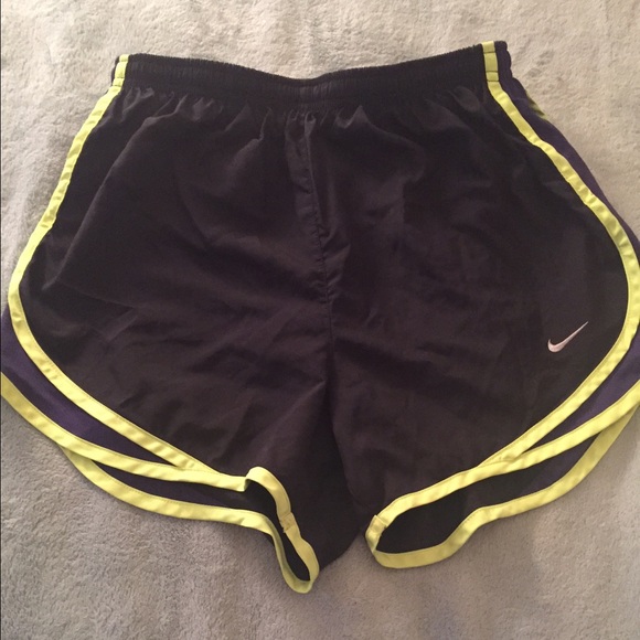 Black, purple, and neon yellow Nike shorts