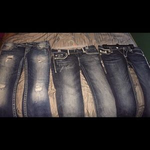Silver jeans with rips, day trip jeans in middle