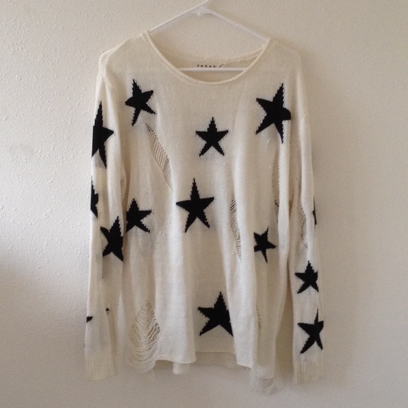 White sweater with black stars