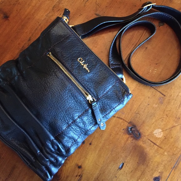Cole Haan black crossbody purse.