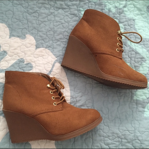 Tan lace-up wedge booties