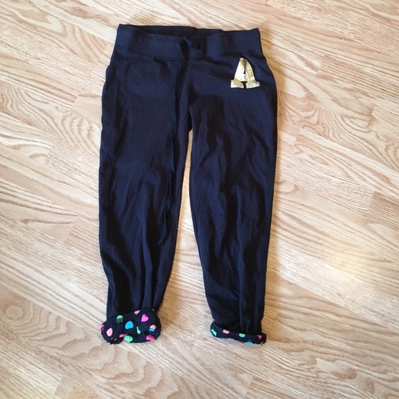 Black sweatpants w/ gold "A"