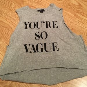 Gray muscle tee that says "you're so vague"