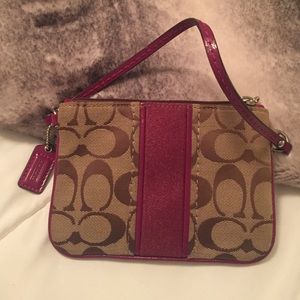 Authentic Coach wristlet.