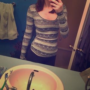 Tight fitting low cut Aztec patterned long sleeve