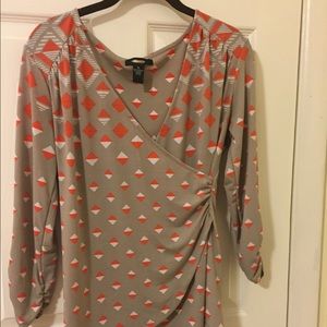 Form fitting low cut top wrap top.