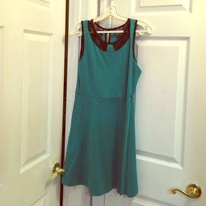 A blue a -line dress with black lace trim