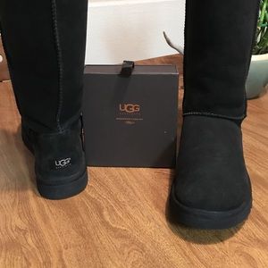 tall black Ugg boots with sheepskin care kit