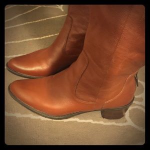Tan-brown Calvin Klein leather boots.