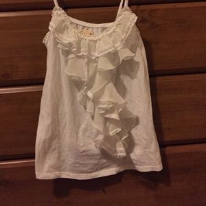 White tank top with ruffles going down the center.