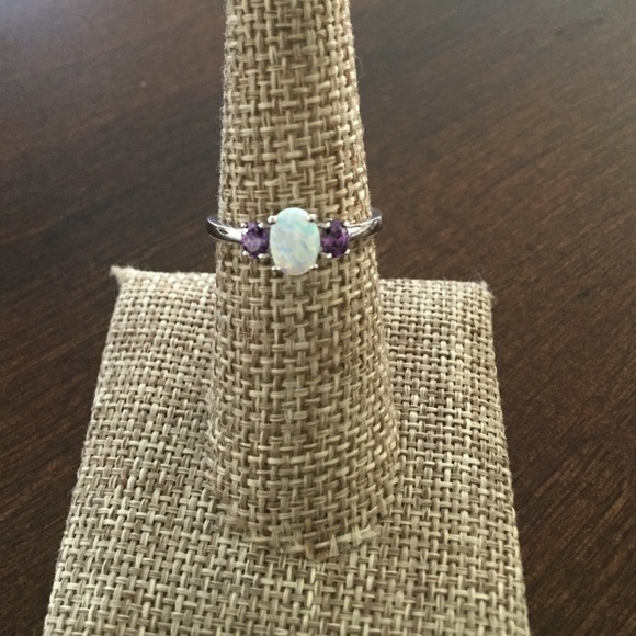 White Lab Opal With Synthetic Amethyst on sides.