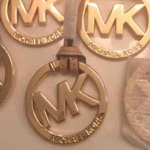 Authentic Michael kors charm golden tan