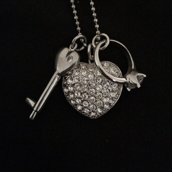 Heart, key, and engagement ring charm necklace