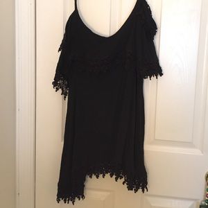 Super detailed over the shoulder dress in black.