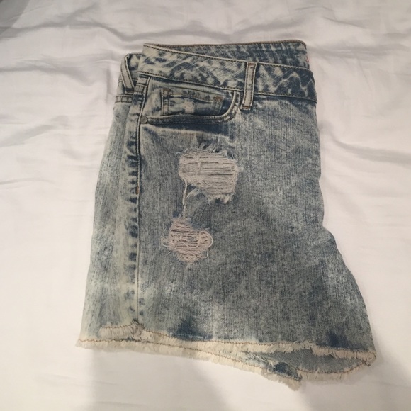 Light wash destroyed shorts.