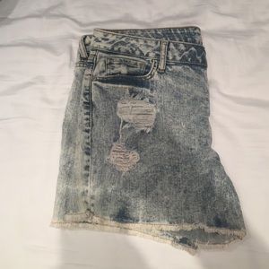 Light wash destroyed shorts.