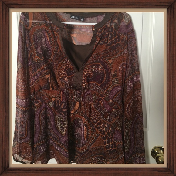 Sheer blouse with brown camisole underneath.